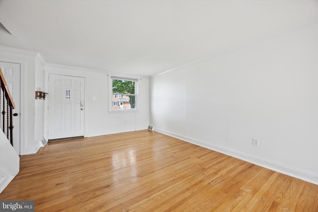 236 Lynn Rd, Ridley Park, PA 19078 - spare room featuring light wood-style flooring, crown molding, and stairway