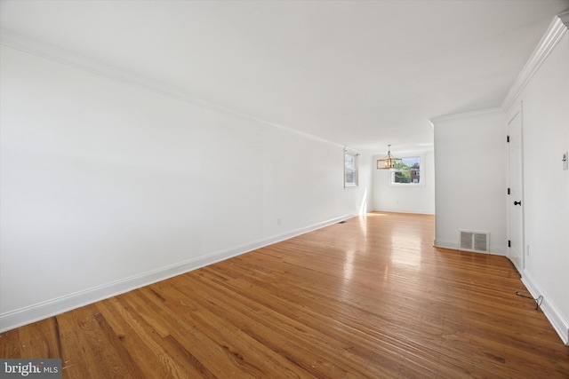 236 Lynn Rd, Ridley Park, PA 19078 - unfurnished room featuring a chandelier, wood finished floors, and crown molding