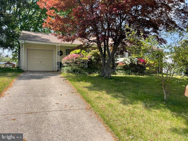 1102 Creswood Rd, Philadelphia, PA 19115 - view of front of house featuring driveway, an attached garage, and a front lawn