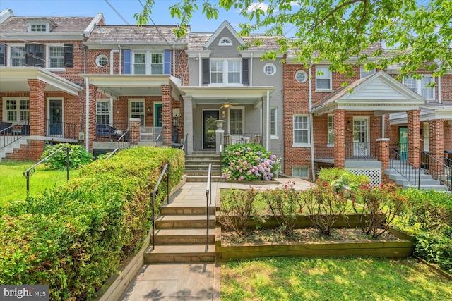 3754 W St NW, Washington, DC 20007 - view of front facade featuring a porch, brick siding, and stairway