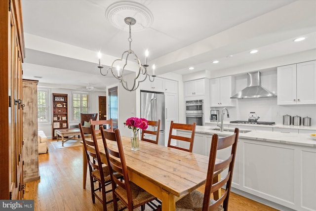 3754 W St NW, Washington, DC 20007 - dining room featuring light wood-style flooring, a ceiling fan, recessed lighting, and a chandelier