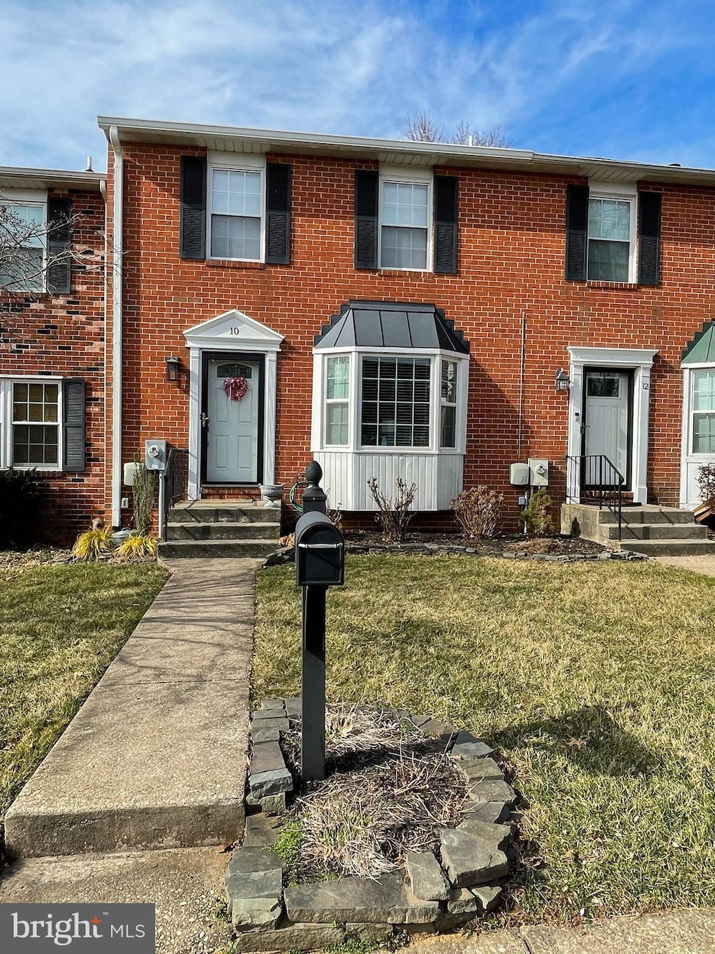 10 Stone Falls Ct, Nottingham, MD 21236 - townhome / multi-family property with a front yard and brick siding
