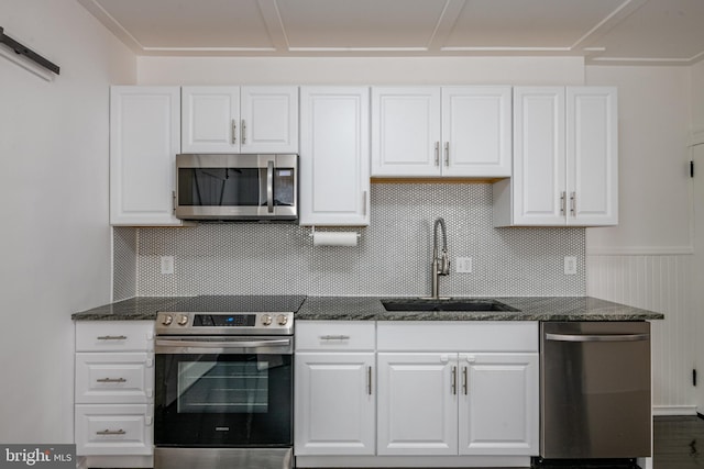 16 S 2nd St, Womelsdorf, PA 19567 - kitchen featuring appliances with stainless steel finishes, white cabinets, and dark stone countertops