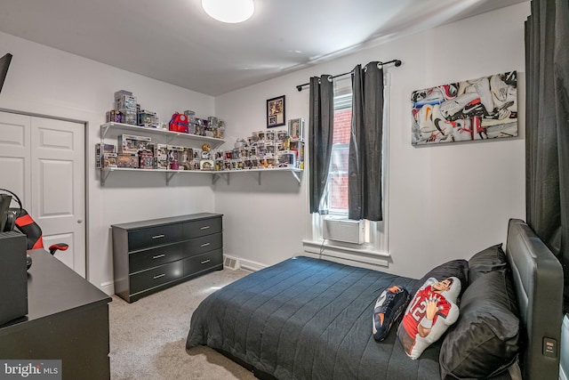 16 S 2nd St, Womelsdorf, PA 19567 - bedroom with light carpet, a closet, cooling unit, and a baseboard heating unit