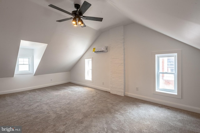 16 S 2nd St, Womelsdorf, PA 19567 - additional living space with carpet floors, vaulted ceiling, a wall unit AC, and a ceiling fan