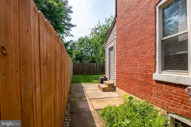 16 S 2nd St, Womelsdorf, PA 19567 - view of side of home with entry steps, a fenced backyard, and brick siding
