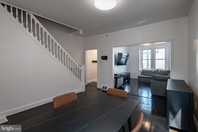 16 S 2nd St, Womelsdorf, PA 19567 - dining area featuring stairs and dark wood-style flooring