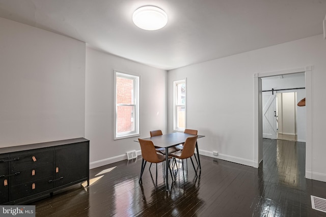 16 S 2nd St, Womelsdorf, PA 19567 - dining area with a barn door and hardwood / wood-style floors