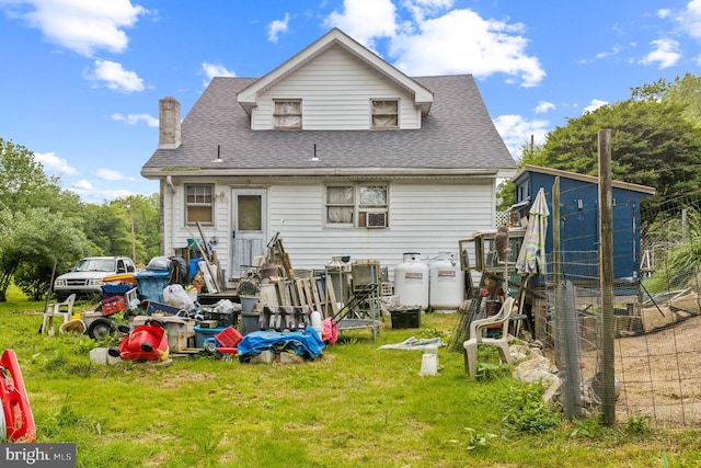 2178 Judith Rd, Hartly, DE 19953 - back of property featuring a chimney, a shingled roof, a lawn, and cooling unit