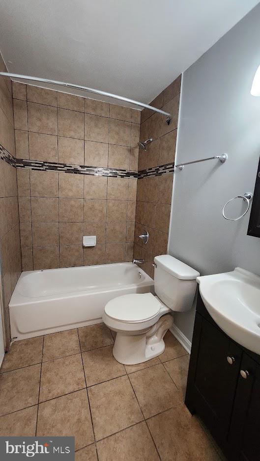 1756 Forest Park Dr, District Heights, MD 20747 - full bathroom featuring vanity, tile patterned floors, and washtub / shower combination