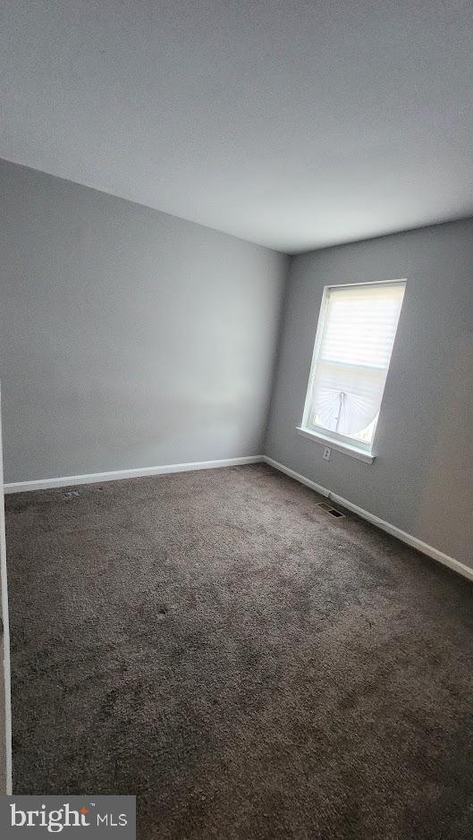 1756 Forest Park Dr, District Heights, MD 20747 - carpeted spare room featuring baseboards