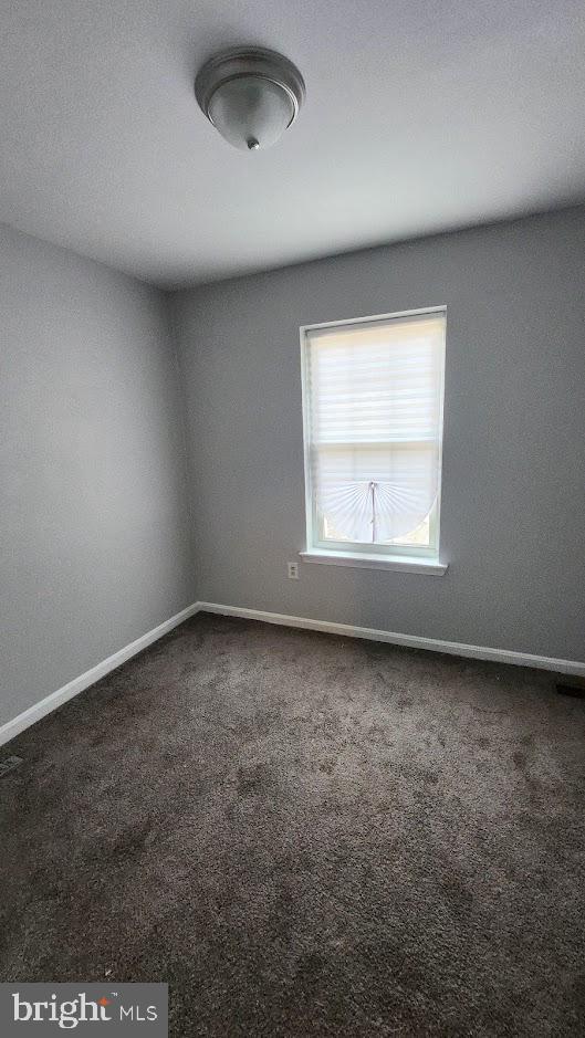 1756 Forest Park Dr, District Heights, MD 20747 - carpeted spare room with baseboards