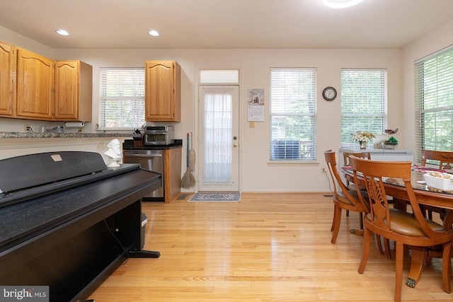 5819 Stream Pond Ct, Centreville, VA 20120 - kitchen with light wood finished floors, plenty of natural light, recessed lighting, dishwasher, and dark countertops
