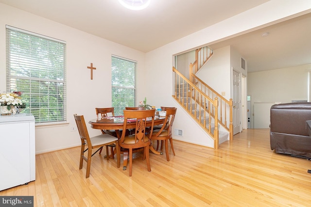 5819 Stream Pond Ct, Centreville, VA 20120 - dining area with stairway, wood finished floors, and healthy amount of natural light