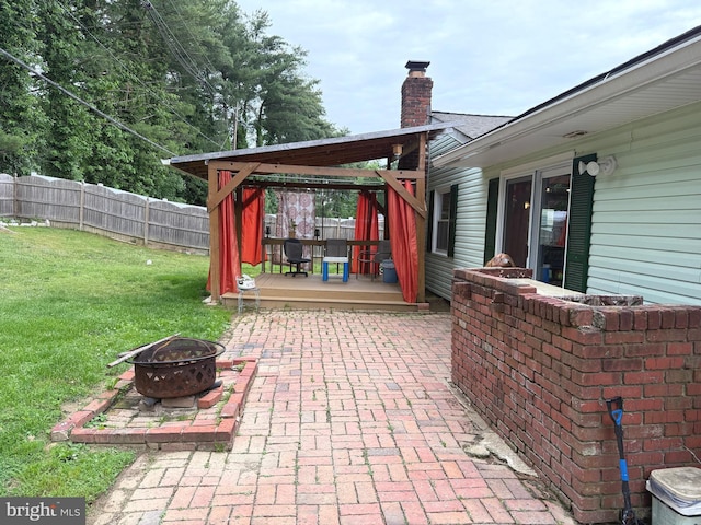 52 Henderson Ln, Willingboro, NJ 08046 - fenced backyard with a fire pit, a deck, and a patio