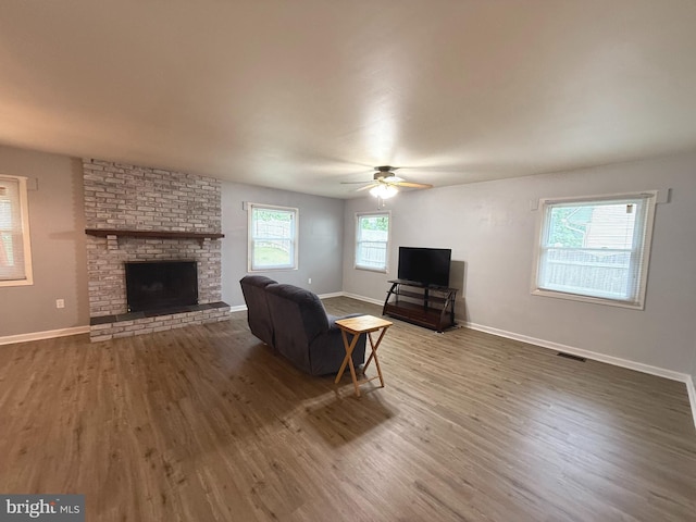 52 Henderson Ln, Willingboro, NJ 08046 - living room with wood finished floors, ceiling fan, and a fireplace