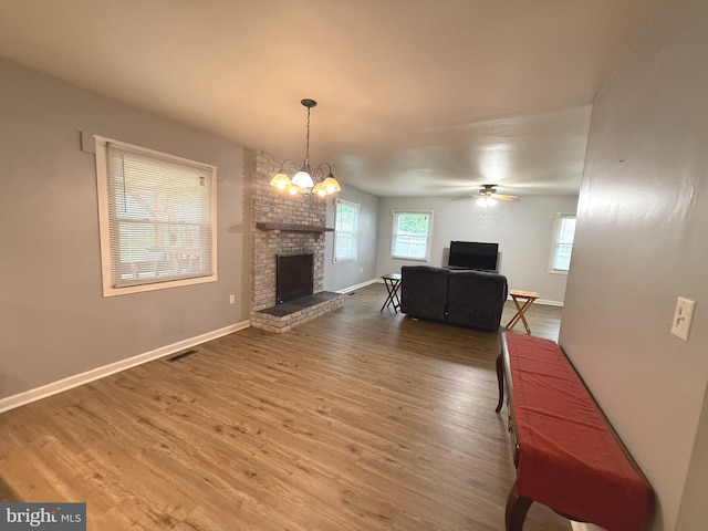 52 Henderson Ln, Willingboro, NJ 08046 - living area with wood finished floors, a fireplace, and a ceiling fan