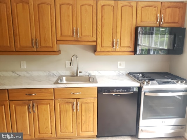 760 Princeton Pl Unit 1-760, Rockville, MD 20850 - kitchen featuring black appliances and brown cabinetry