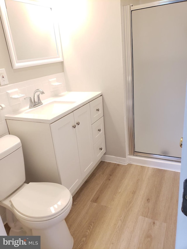 760 Princeton Pl Unit 1-760, Rockville, MD 20850 - full bathroom with a stall shower, wood finished floors, vanity, and decorative backsplash