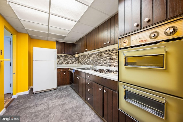 801 Yale Ave Unit 827, Swarthmore, PA 19081 - kitchen featuring white appliances, a paneled ceiling, a warming drawer, dark brown cabinets, and light countertops