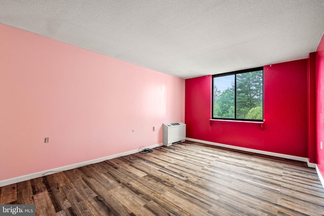 801 Yale Ave Unit 827, Swarthmore, PA 19081 - spare room featuring wood finished floors and a textured ceiling