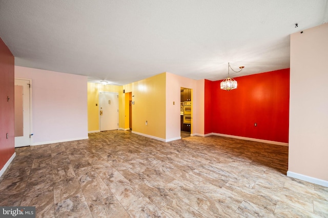 801 Yale Ave Unit 827, Swarthmore, PA 19081 - spare room featuring baseboards and a chandelier