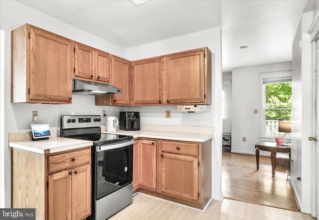 606 Knightsbridge Dr, Hagerstown, MD 21740 - kitchen featuring stainless steel electric range oven, range hood, light countertops, and light flooring