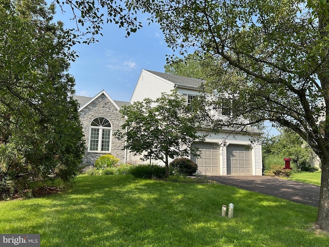 505 Country Pointe Cir, Perkasie, PA 18944 - view of front of home featuring stone siding, a front lawn, driveway, and an attached garage
