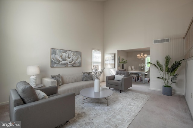 505 Country Pointe Cir, Perkasie, PA 18944 - living room with carpet floors, a chandelier, and a towering ceiling