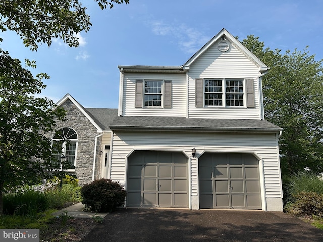 505 Country Pointe Cir, Perkasie, PA 18944 - view of front facade featuring an attached garage, driveway, and stone siding