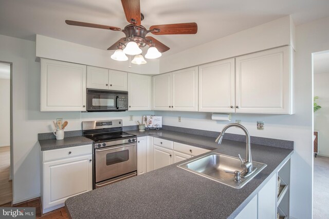 505 Country Pointe Cir, Perkasie, PA 18944 - kitchen with black microwave, stainless steel electric stove, dark countertops, and white cabinetry