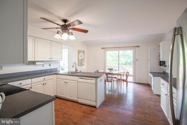 505 Country Pointe Cir, Perkasie, PA 18944 - kitchen with white appliances, a peninsula, ceiling fan, dark countertops, and white cabinetry