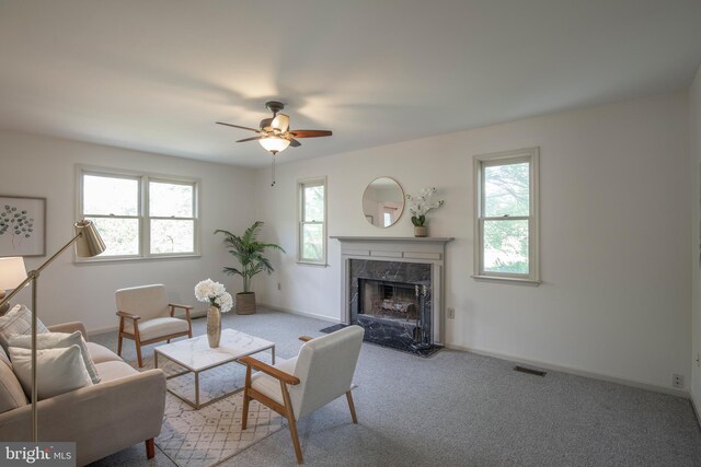 505 Country Pointe Cir, Perkasie, PA 18944 - carpeted living room with ceiling fan and a high end fireplace