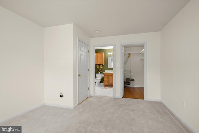 2044 Astilbe Way Unit 2044, Odenton, MD 21113 - unfurnished bedroom with light colored carpet, ensuite bath, and a spacious closet