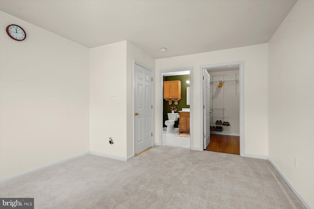 2044 Astilbe Way Unit 2044, Odenton, MD 21113 - unfurnished bedroom featuring light colored carpet and connected bathroom