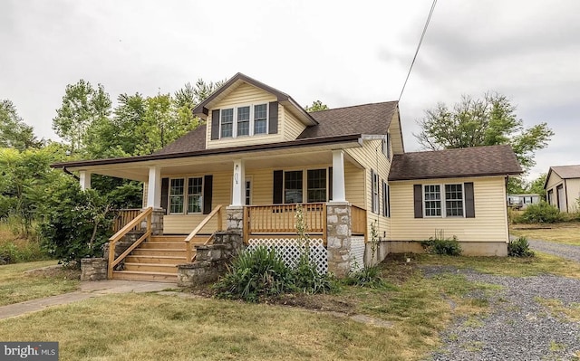 9434 Winchester Ave, Bunker Hill, WV 25413 - bungalow-style house with covered porch, a shingled roof, and a front yard