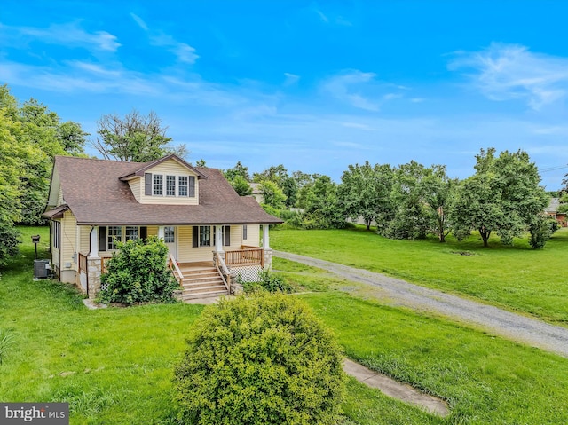 9434 Winchester Ave, Bunker Hill, WV 25413 - bungalow-style house featuring covered porch, a front lawn, roof with shingles, and stairs