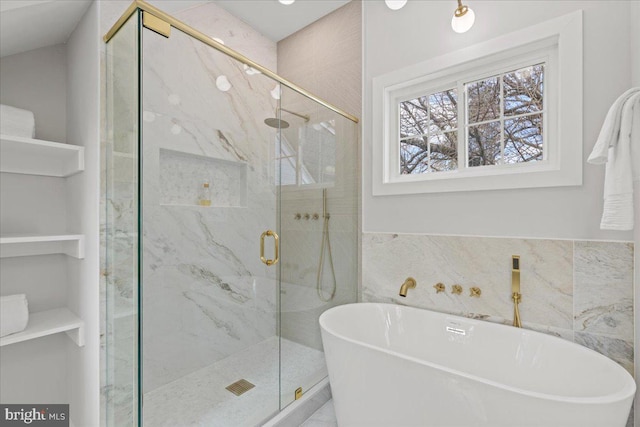 1705 Corwin Dr, Silver Spring, MD 20910 - full bath with a freestanding tub, a marble finish shower, tile walls, and built in features