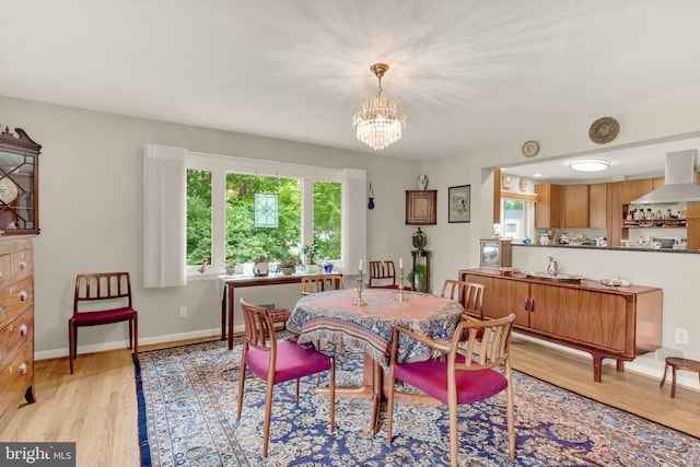 10135 Spring Pools Ln, Columbia, MD 21044 - dining area with a chandelier and light wood-type flooring