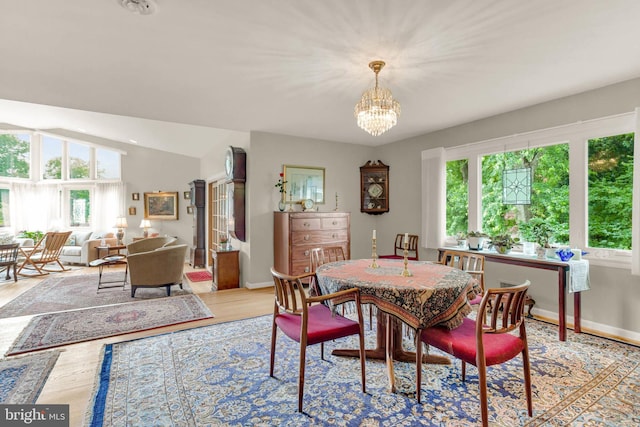10135 Spring Pools Ln, Columbia, MD 21044 - dining room featuring a chandelier, light wood-type flooring, and lofted ceiling