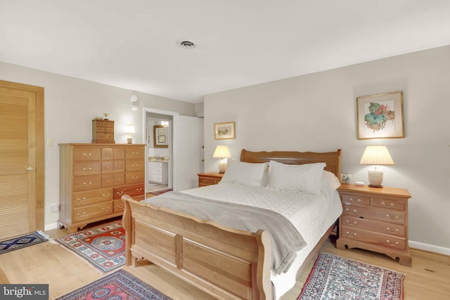 10135 Spring Pools Ln, Columbia, MD 21044 - bedroom featuring light wood-type flooring and ensuite bathroom