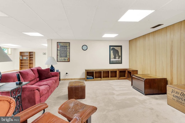 10135 Spring Pools Ln, Columbia, MD 21044 - living room with carpet floors, wood walls, and a drop ceiling