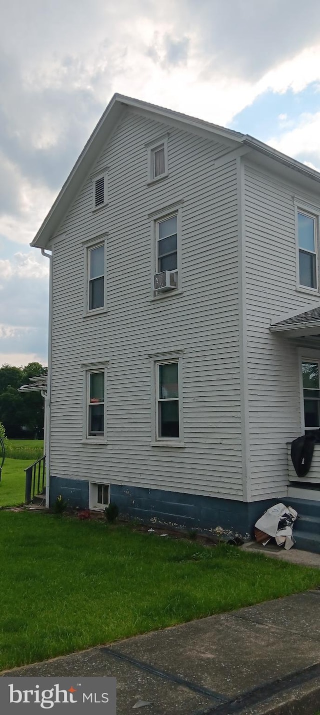 106 Center St, Manns Choice, PA 15550 - view of home's exterior featuring a lawn and cooling unit