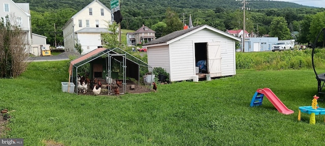 106 Center St, Manns Choice, PA 15550 - view of shed featuring a view of trees and exterior structure