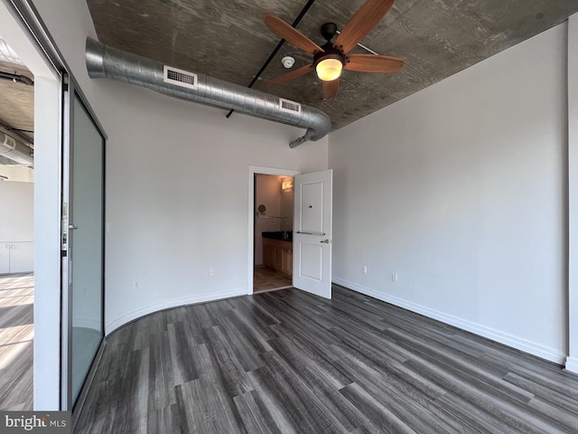 301 Massachusetts Ave NW Unit 301, Washington, DC 20001 - unfurnished bedroom featuring dark wood-type flooring and baseboards
