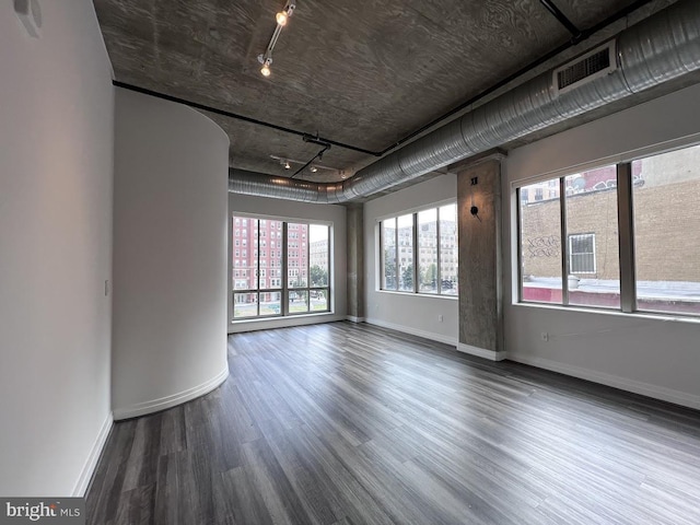 301 Massachusetts Ave NW Unit 301, Washington, DC 20001 - empty room with wood finished floors, rail lighting, and arched walkways