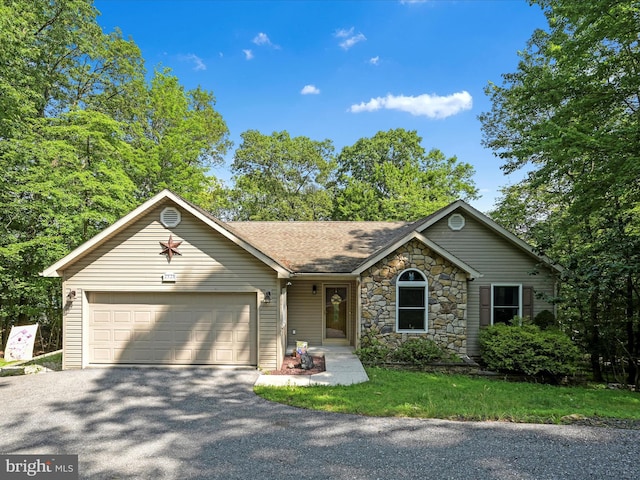 2528 Papoose Dr, Auburn, PA 17922 - ranch-style house with an attached garage, driveway, roof with shingles, and stone siding