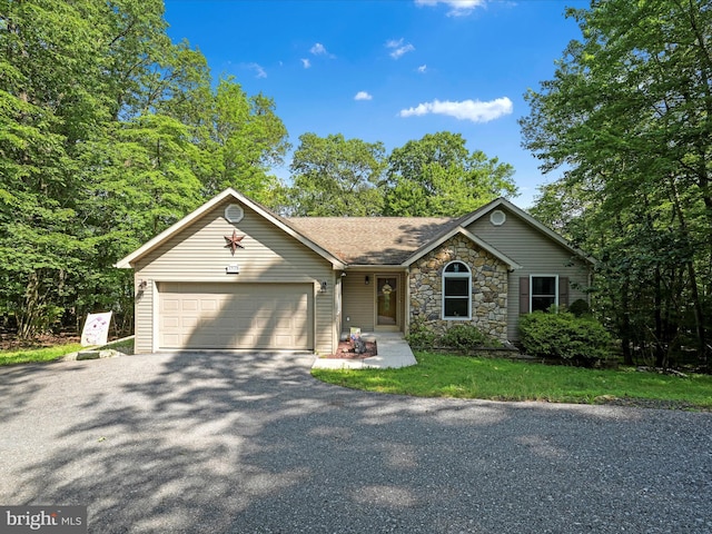 2528 Papoose Dr, Auburn, PA 17922 - ranch-style home with an attached garage, asphalt driveway, stone siding, and a shingled roof