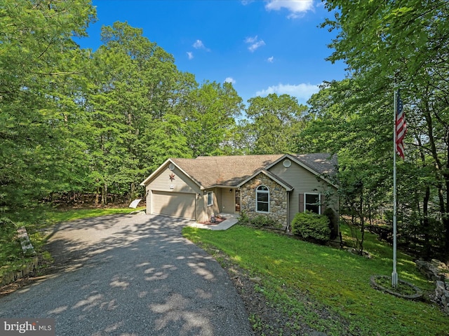 2528 Papoose Dr, Auburn, PA 17922 - ranch-style house featuring asphalt driveway, a garage, a front yard, stone siding, and roof with shingles