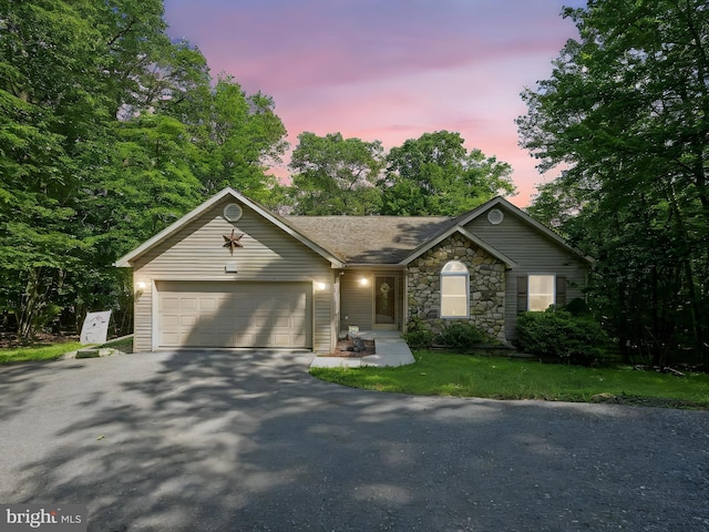 2528 Papoose Dr, Auburn, PA 17922 - ranch-style house with asphalt driveway, an attached garage, and stone siding